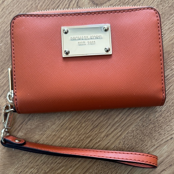 Michael Kors Accessories - Michael Kors Tangerine Wristlet with Gold Accents